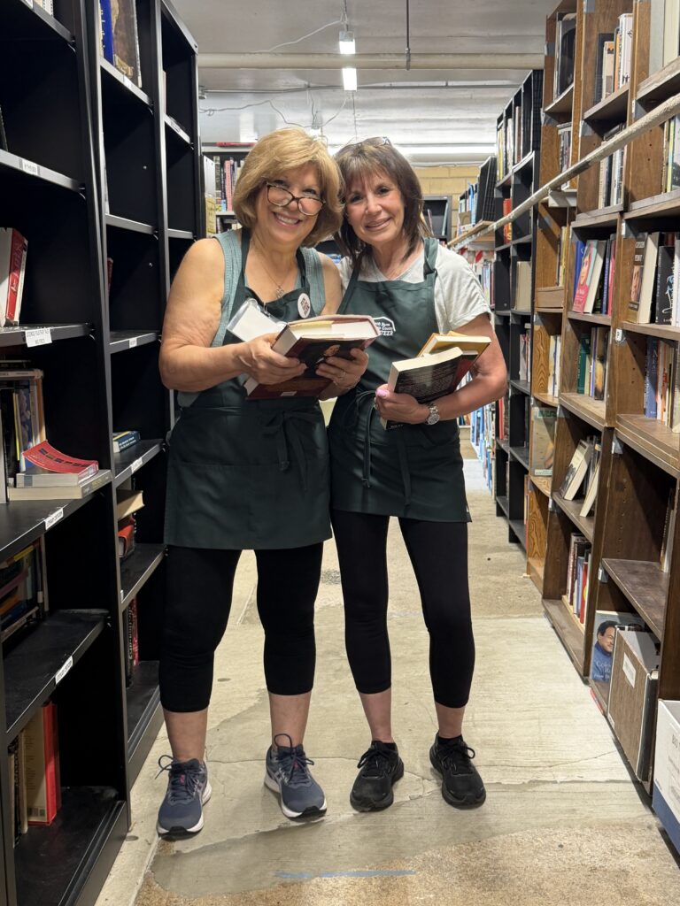 Book Barn volunteer organizing donated books